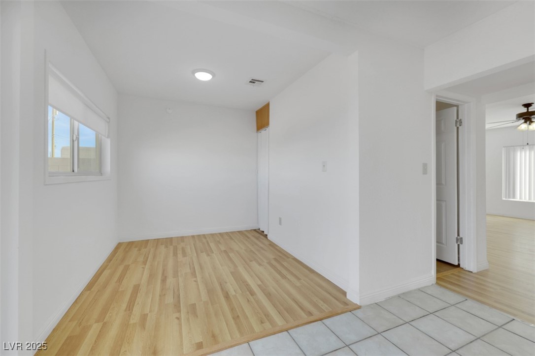11 California Way Henderson, NV 89015 - Photo 9 of 17 Empty room with healthy amount of natural light, light wood-type flooring, and a ceiling fan