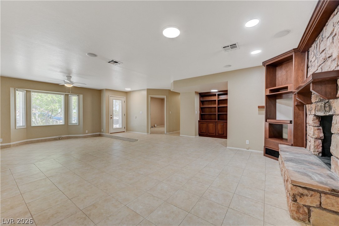 7631 Bermuda Road Las Vegas, NV 89123 - Photo 13 of 64 Ample floor space and a built-in entertainment center make this room perfect for gatherings.
