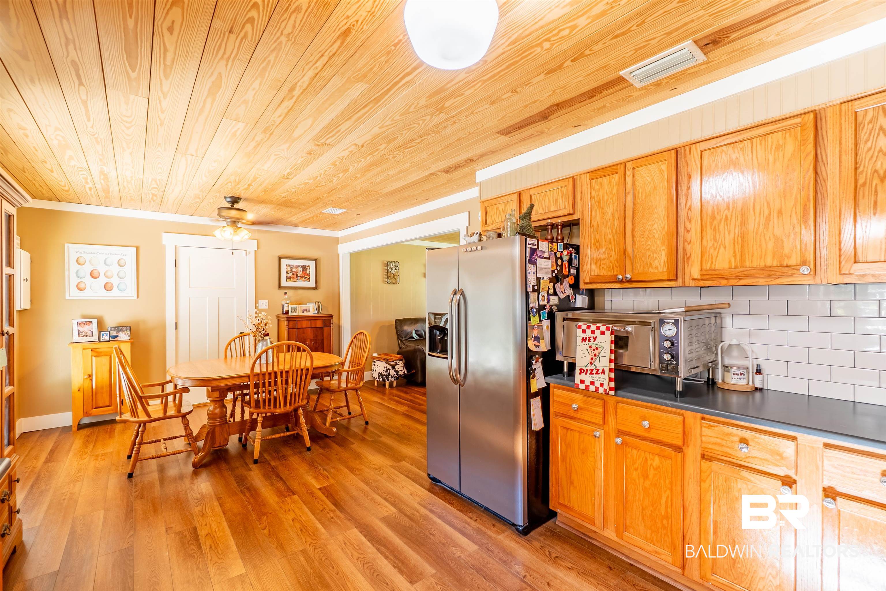 Great Abundance of Wood Cabinets & Quartz Counter tops, Stainless Appliances, Tile Back Splash, Smart Core Waterproof Flooring, and the Wood Ceilings makes this Kitchen the "Chef's Kiss".