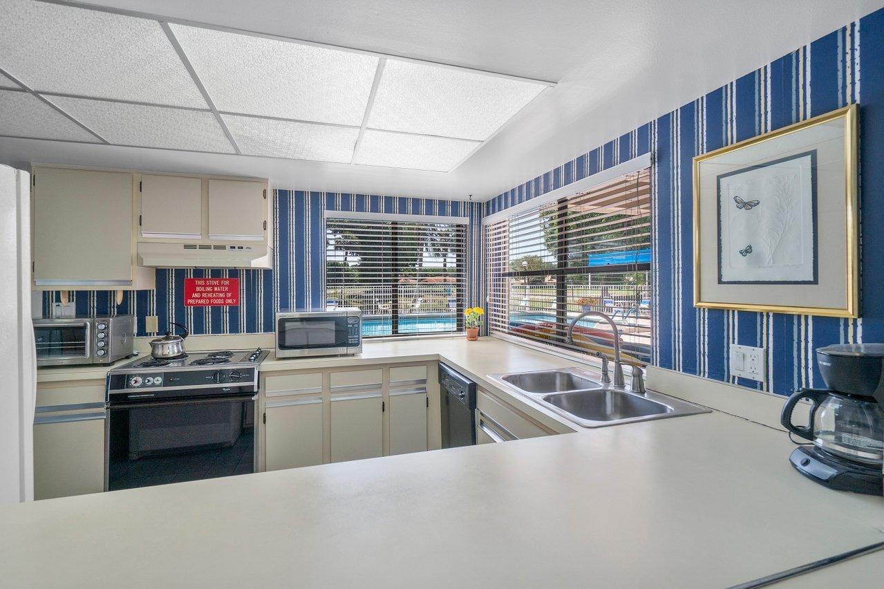6562 Boca Del Mar Drive, Unit 524 Boca Raton, FL 33433 - Photo 30 of 37 Clubhouse Kitchen