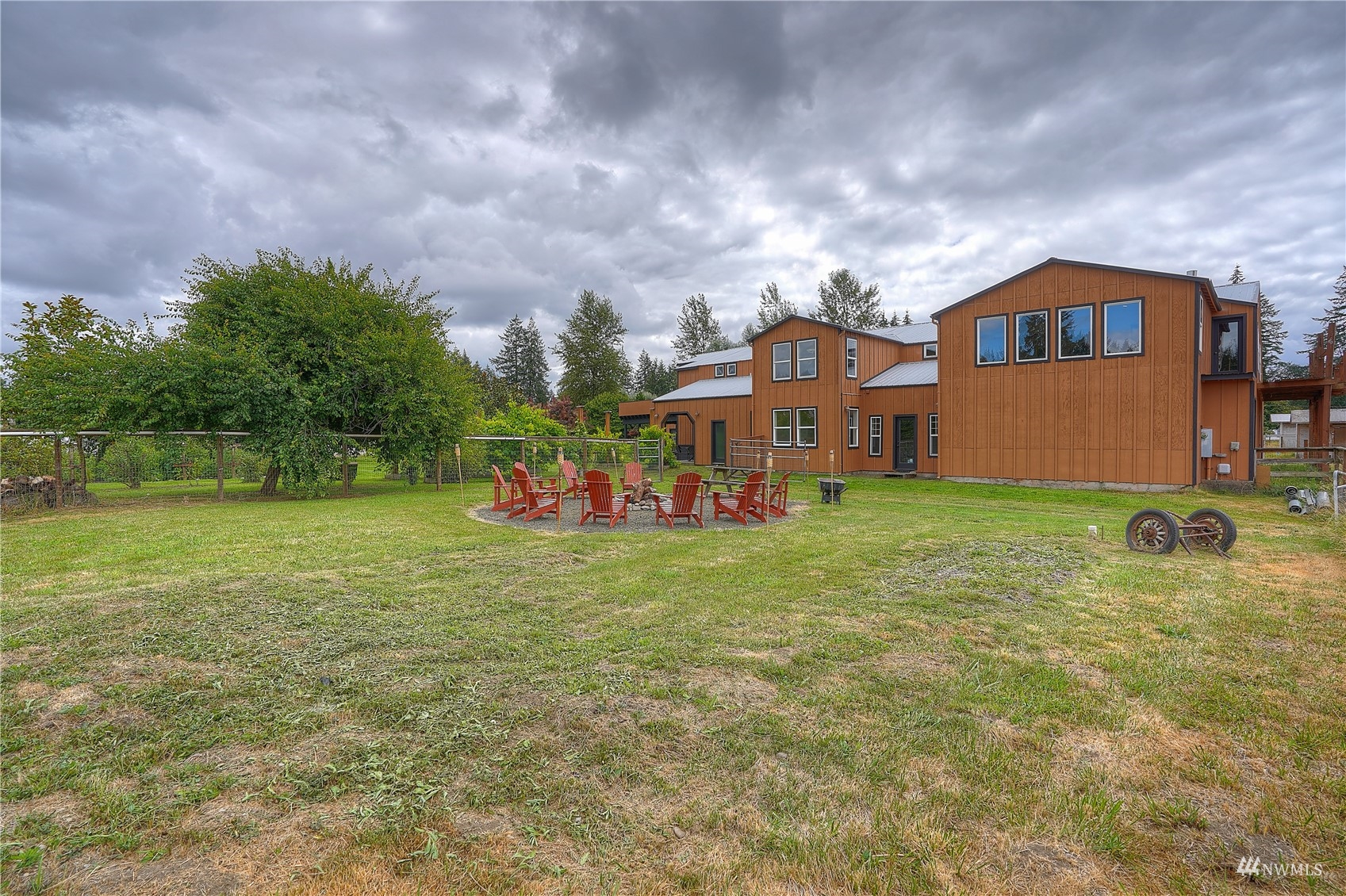 10542 School Land Road Southwest Rochester, WA 98579 - Photo 8 of 40 a front view of a house with garden