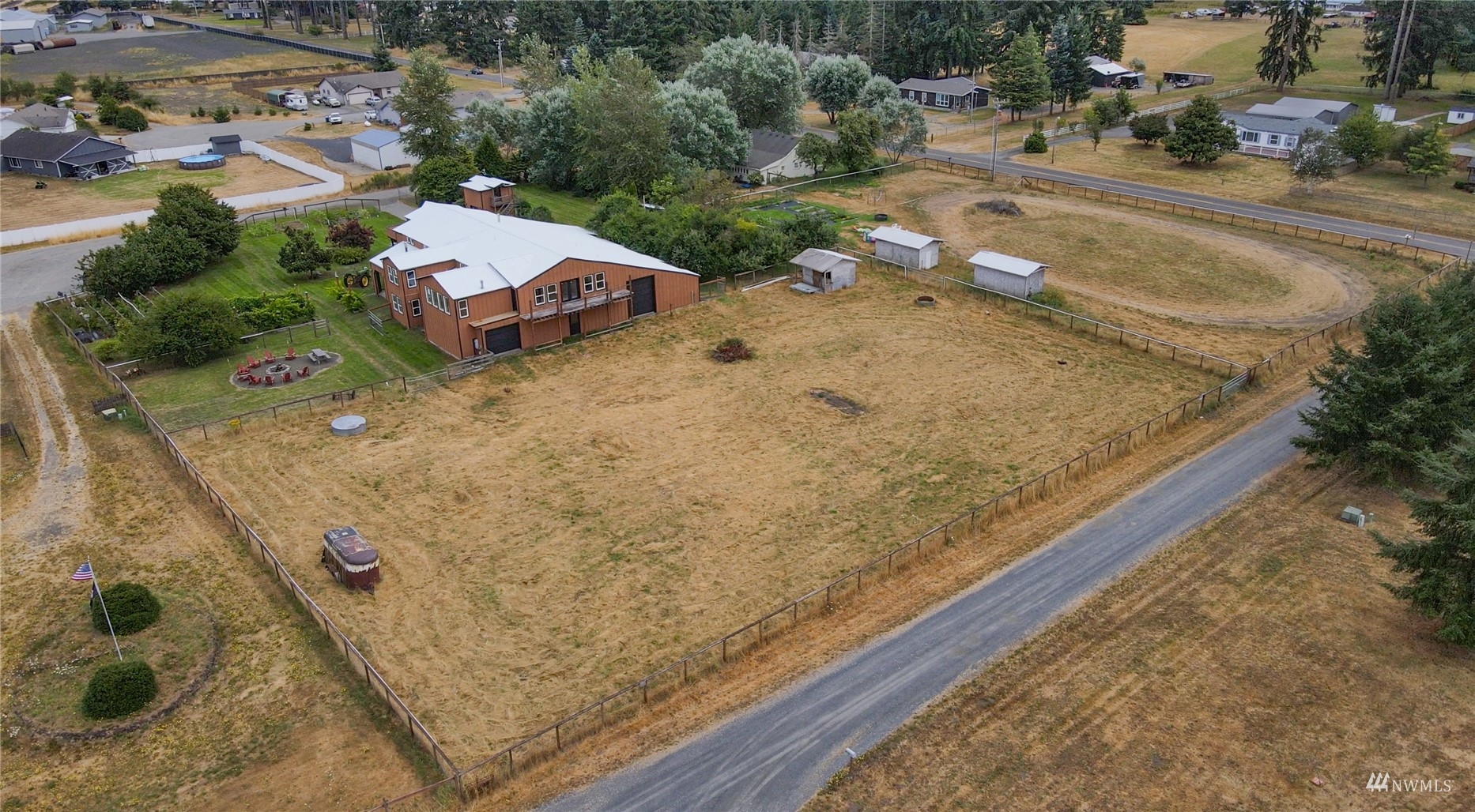 10542 School Land Road Southwest Rochester, WA 98579 - Photo 9 of 40 a view of a house with a yard