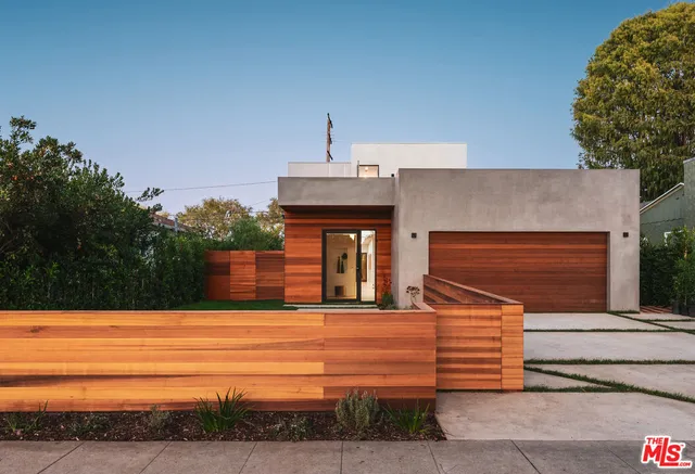 a front view of a house with yard