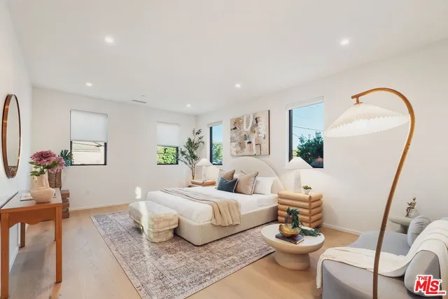 a living room with furniture and a mirror
