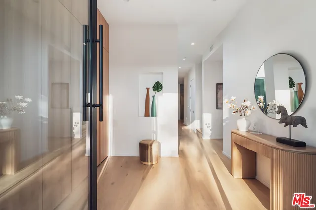 a view of living room with furniture and a fireplace