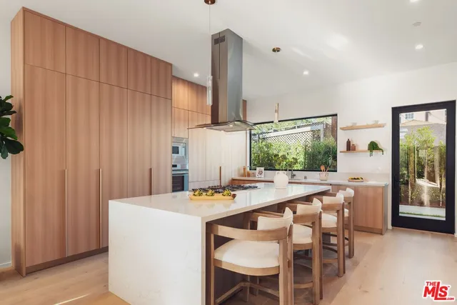 a kitchen with a table and chairs in it