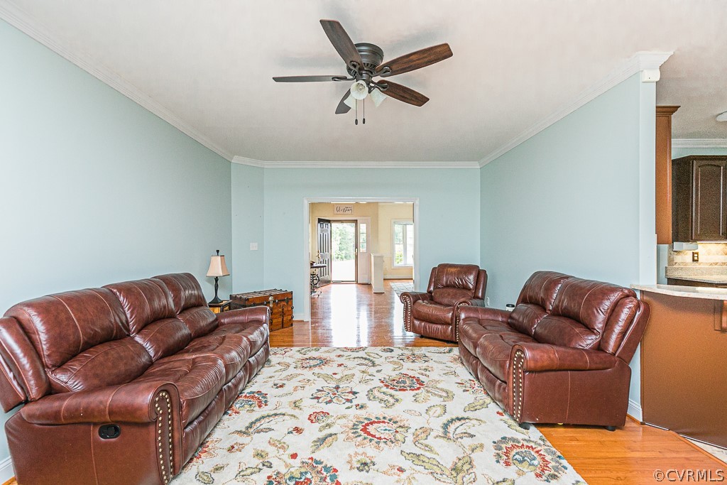 15195 Taylor Road Beaverdam, VA 23015 - Photo 6 of 45 a living room with furniture ceiling fan and a rug