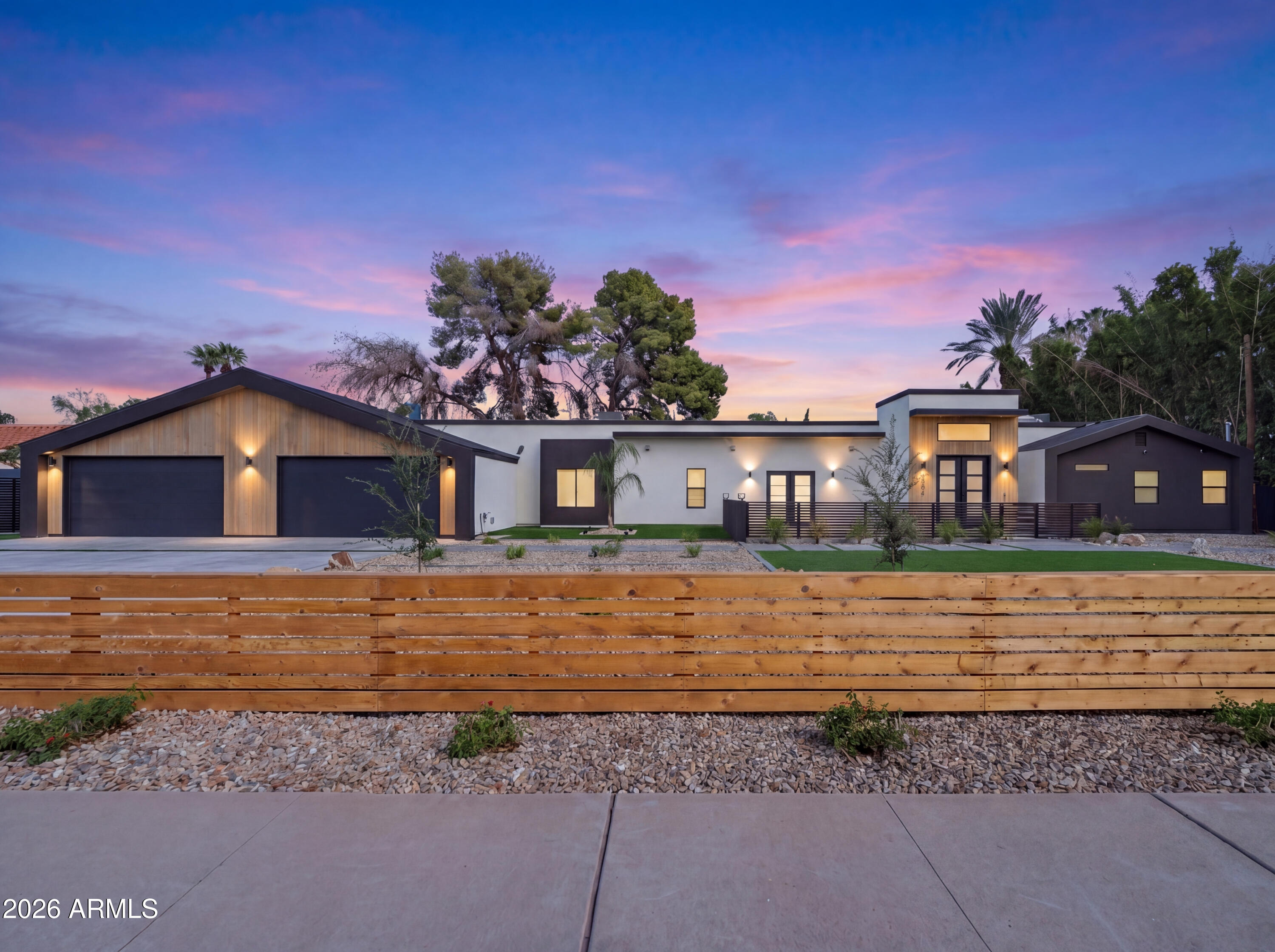 7717 North 7th Avenue Phoenix, AZ 85021 - Photo 1 of 31 a front view of a house with a yard