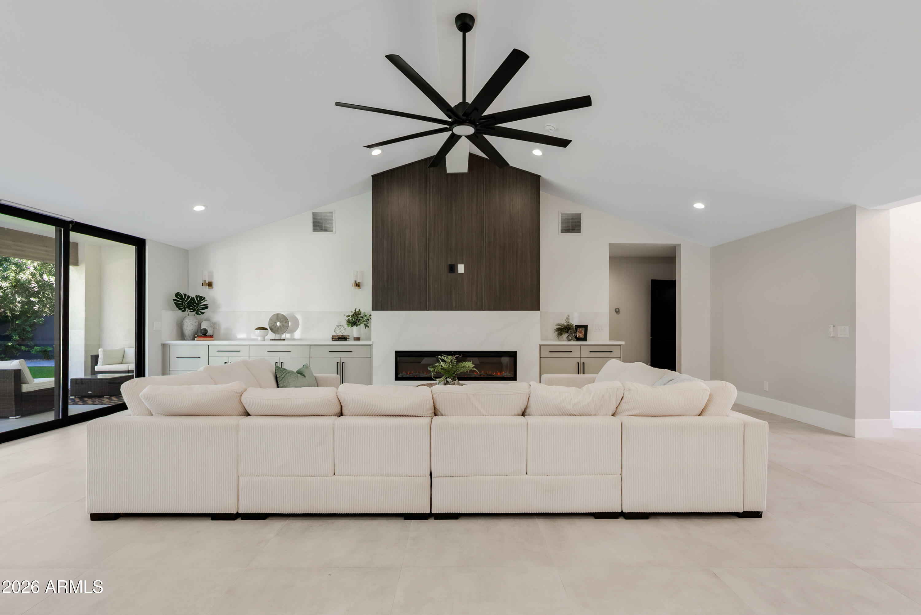 7717 North 7th Avenue Phoenix, AZ 85021 - Photo 11 of 31 a living room with furniture a ceiling fan and a rug