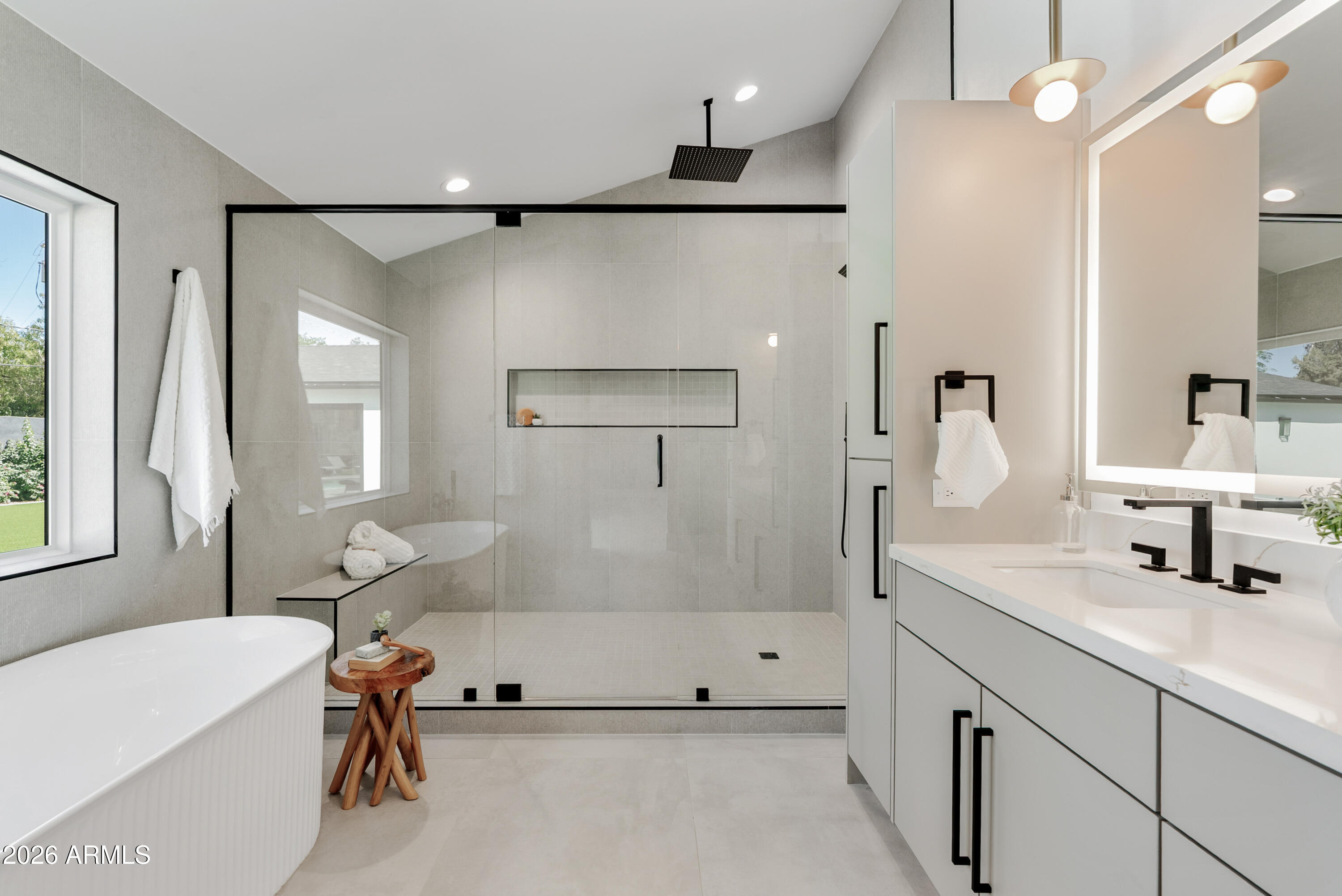 7717 North 7th Avenue Phoenix, AZ 85021 - Photo 14 of 31 a bathroom with a tub sink a mirror and a shower