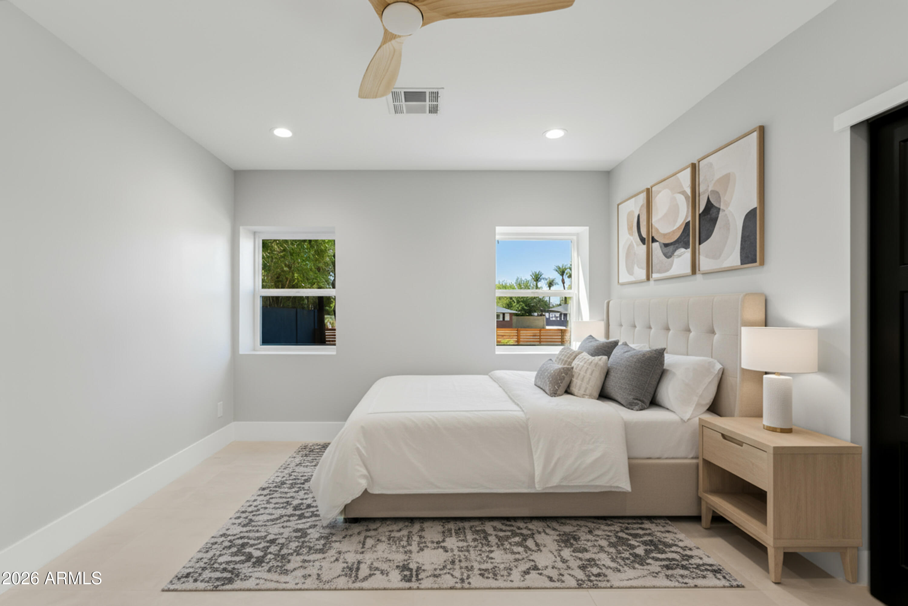 7717 North 7th Avenue Phoenix, AZ 85021 - Photo 22 of 31 a bedroom with a large bed and a couch