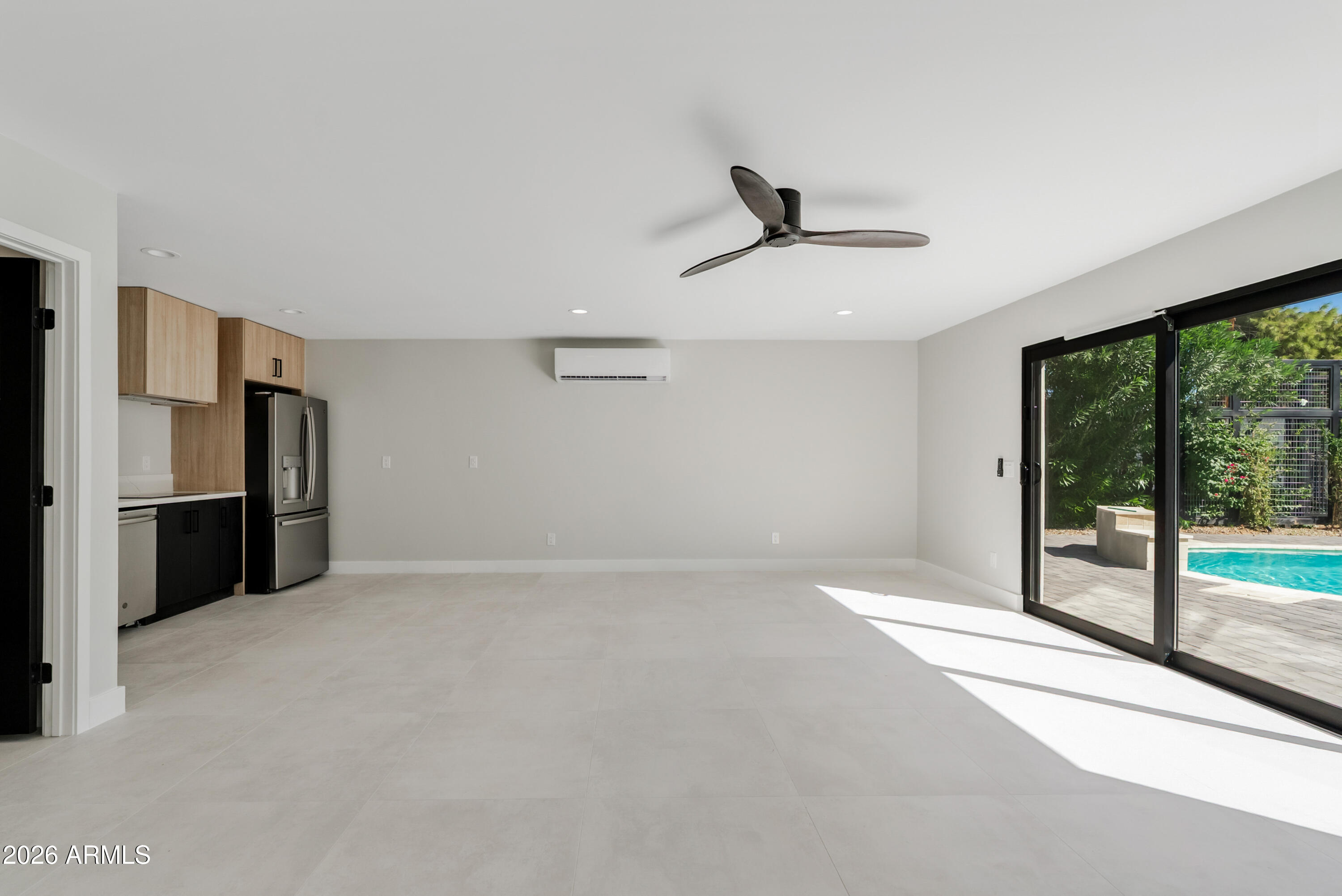 7717 North 7th Avenue Phoenix, AZ 85021 - Photo 26 of 31 a view of empty room with floor to ceiling window