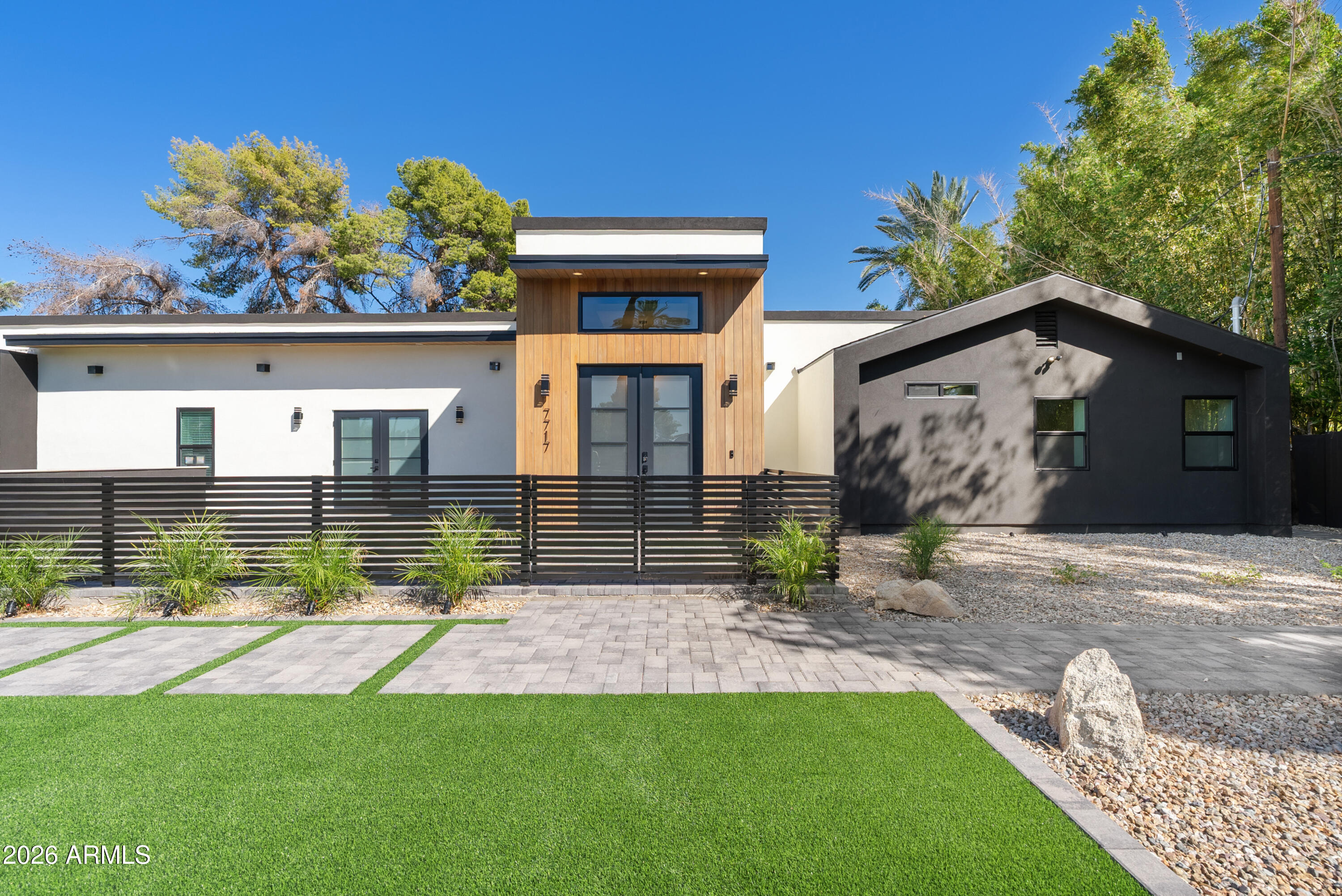 7717 North 7th Avenue Phoenix, AZ 85021 - Photo 27 of 31 a view of house with swimming pool and glass windows
