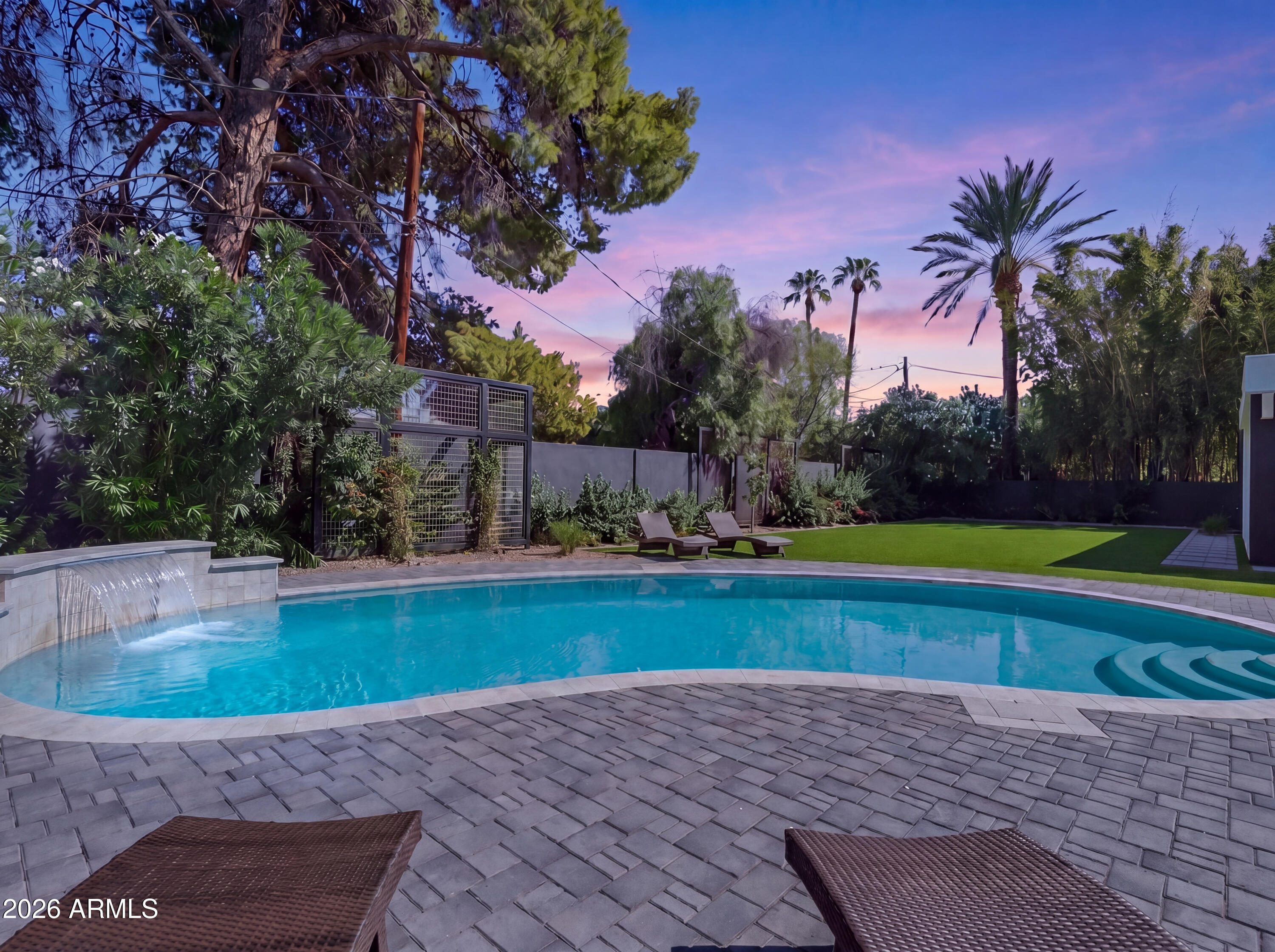 7717 North 7th Avenue Phoenix, AZ 85021 - Photo 3 of 31 a view of a swimming pool with a yard