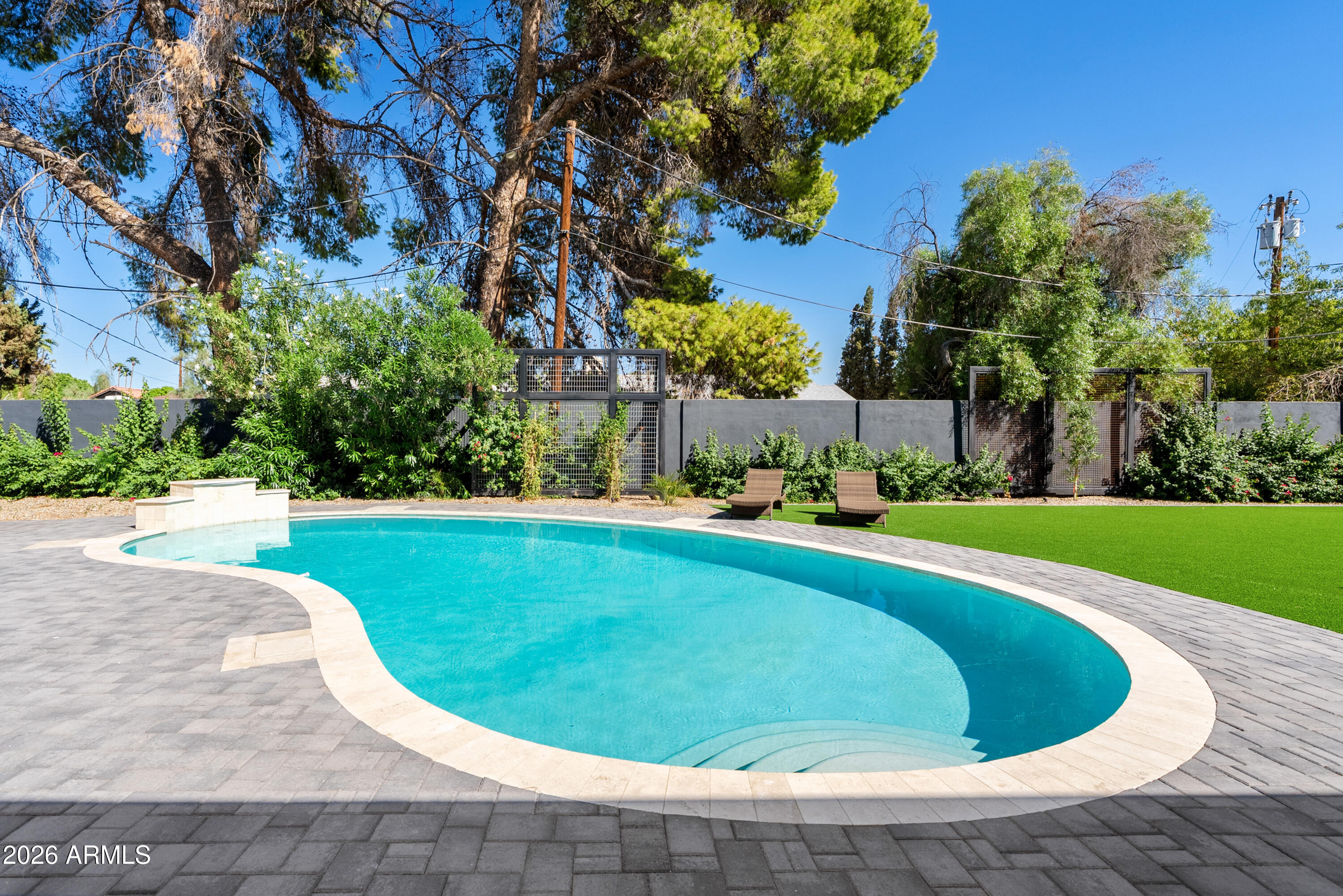 7717 North 7th Avenue Phoenix, AZ 85021 - Photo 31 of 31 a view of a swimming pool with a yard