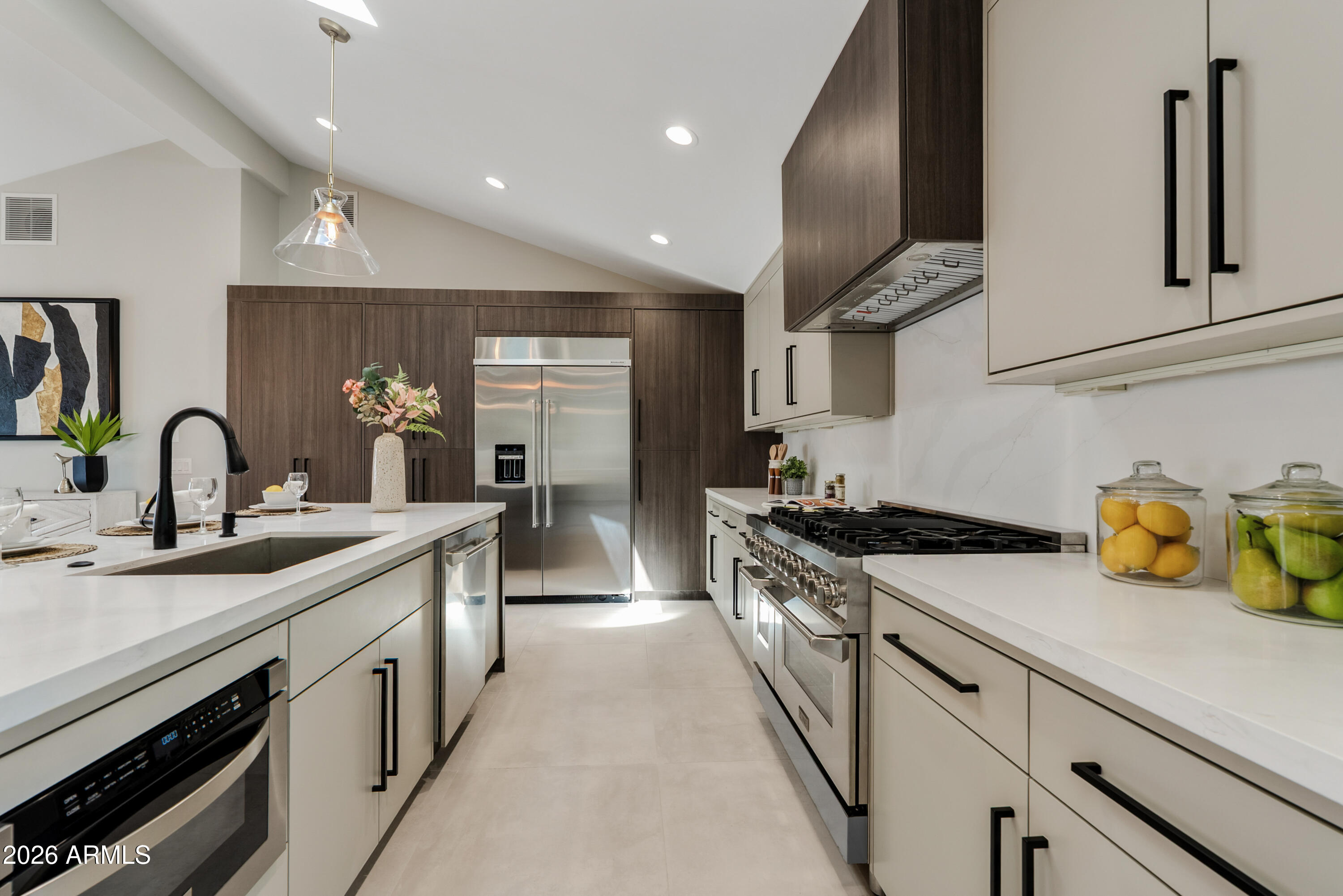 7717 North 7th Avenue Phoenix, AZ 85021 - Photo 5 of 31 a kitchen with a sink stainless steel appliances and cabinets