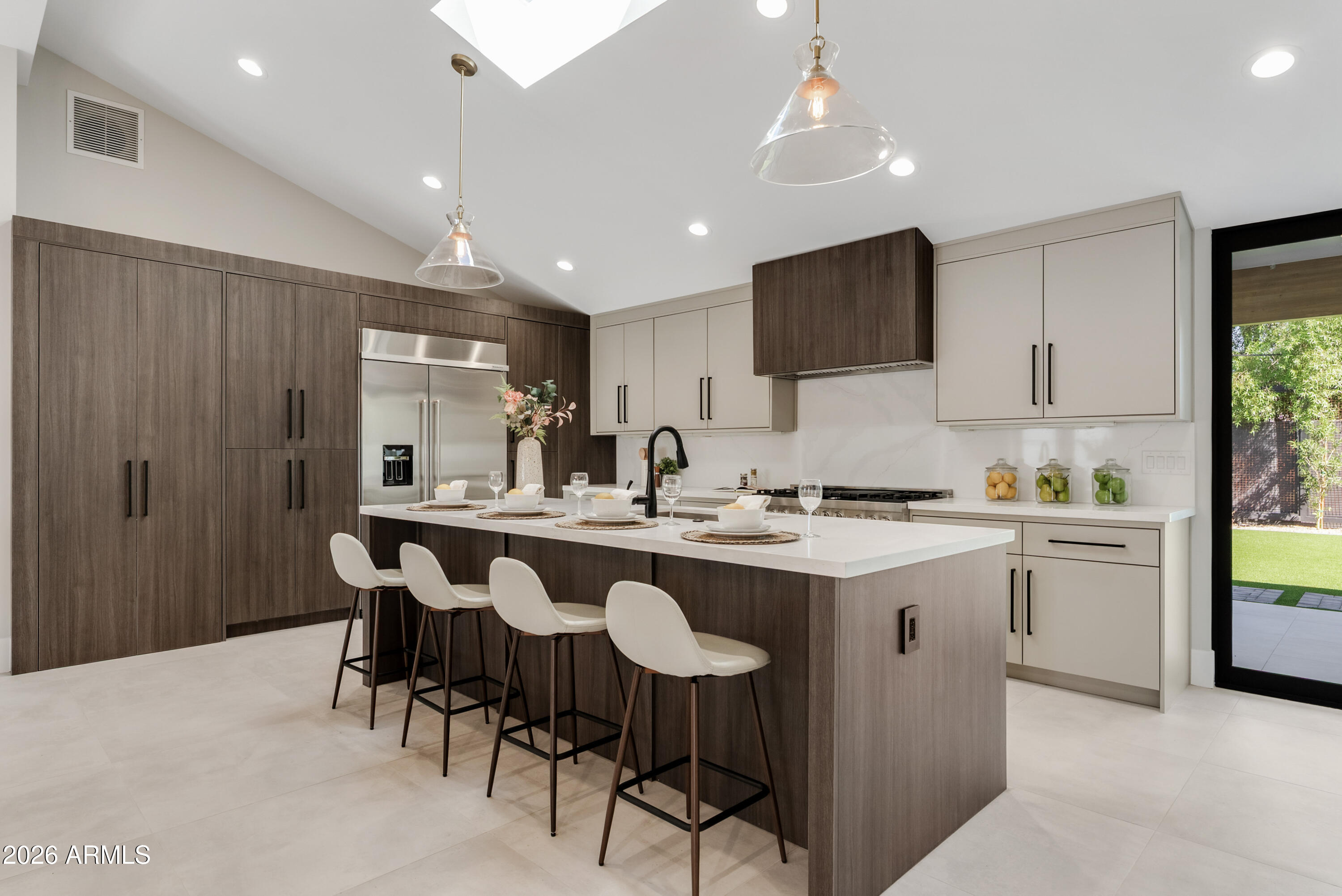 7717 North 7th Avenue Phoenix, AZ 85021 - Photo 6 of 31 a kitchen with center island table and chairs