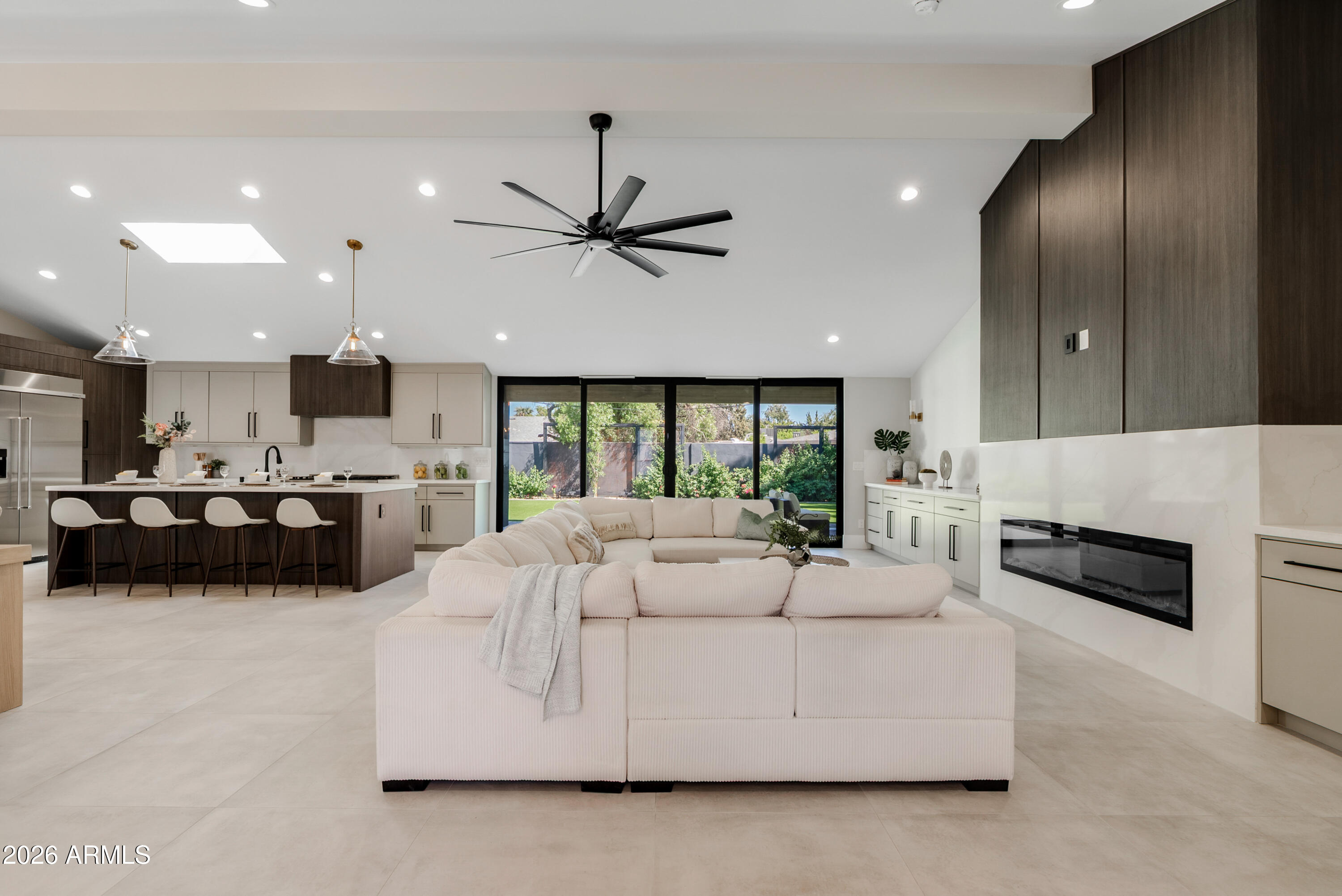 7717 North 7th Avenue Phoenix, AZ 85021 - Photo 10 of 31 a living room with furniture kitchen view and a chandelier