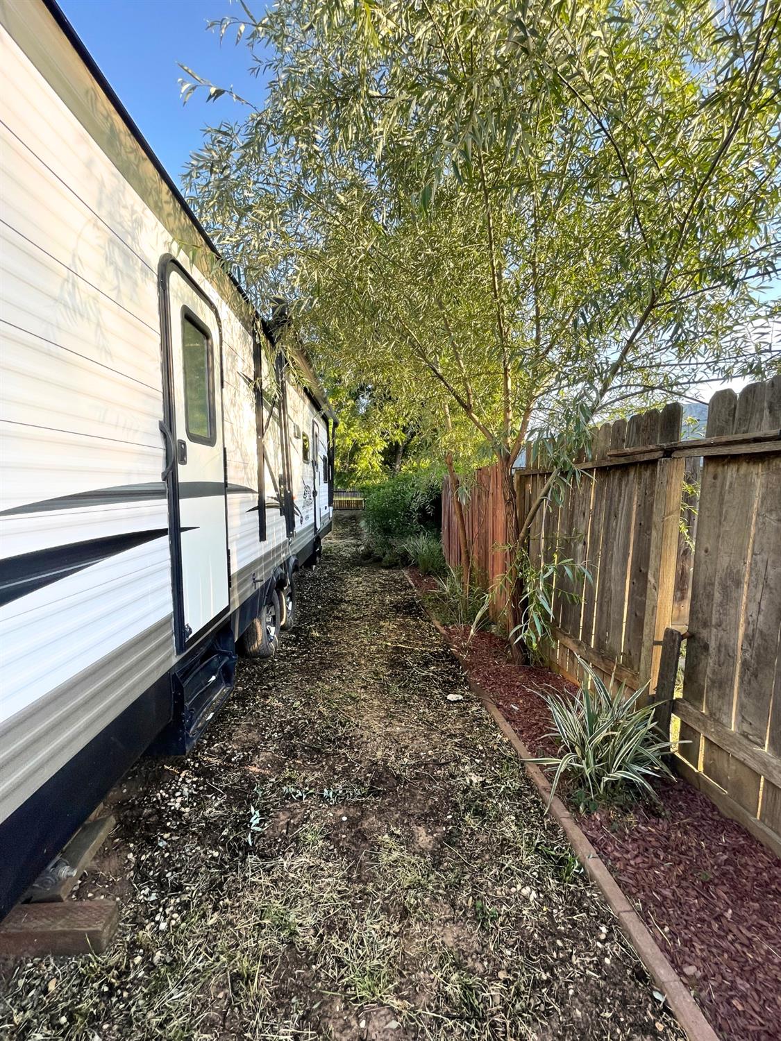 5121 Kenneth Avenue Carmichael, CA 95608 - Photo 25 of 38 a backyard of a house with lots of green space