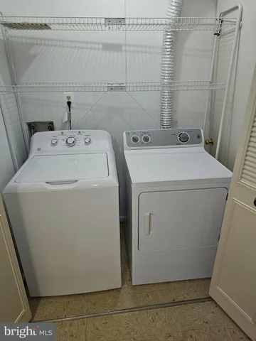 a view of a house with tub and a barbeque