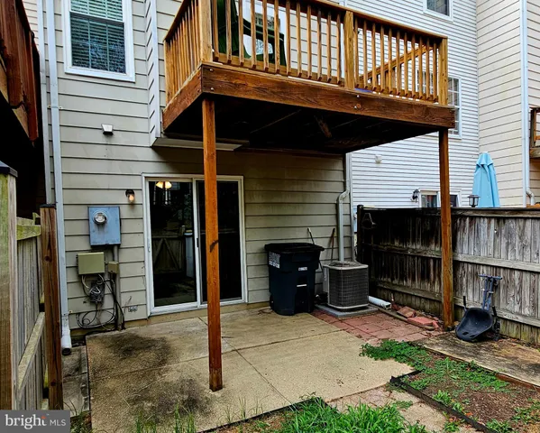 a view of a house with wooden deck