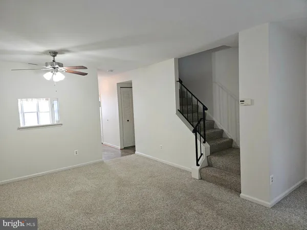 a view of balcony with wooden floor and outdoor seating