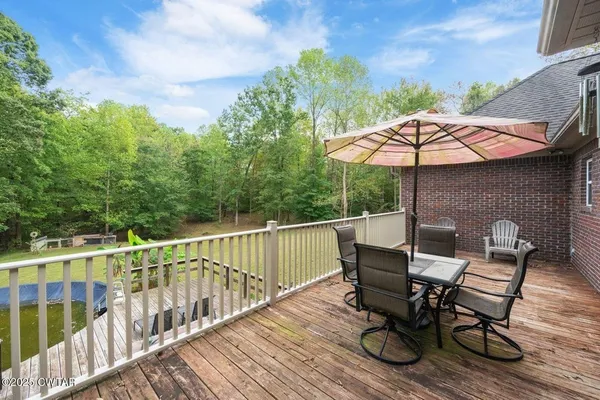 a view of a terrace with wooden floor and outdoor seating