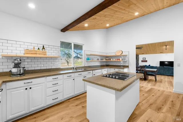 a living room with furniture and a swimming pool