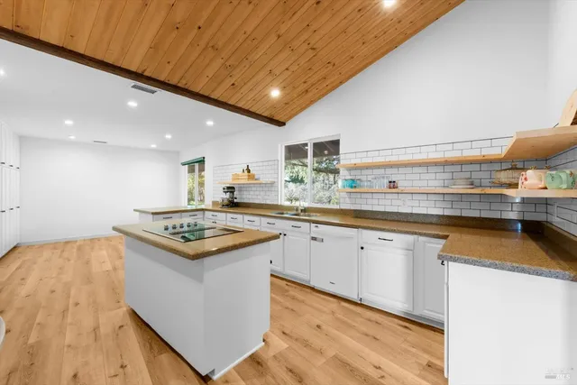 a bathroom with a sink a vanity and a mirror