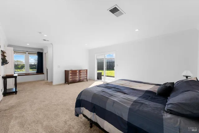 a view of a house with swimming pool and sitting area