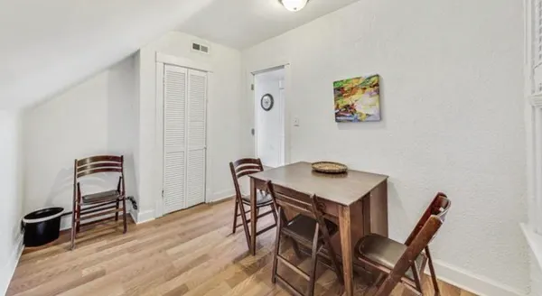 a room with a table and chairs