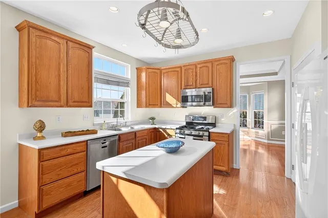 a kitchen with a stove a sink and a refrigerator