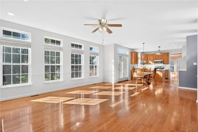 a view of a dining room with furniture window and wooden floor
