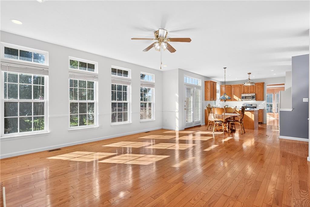 809 Wible Run Road Pittsburgh, PA 15209 - Photo 12 of 36 a view of a dining room with furniture window and wooden floor
