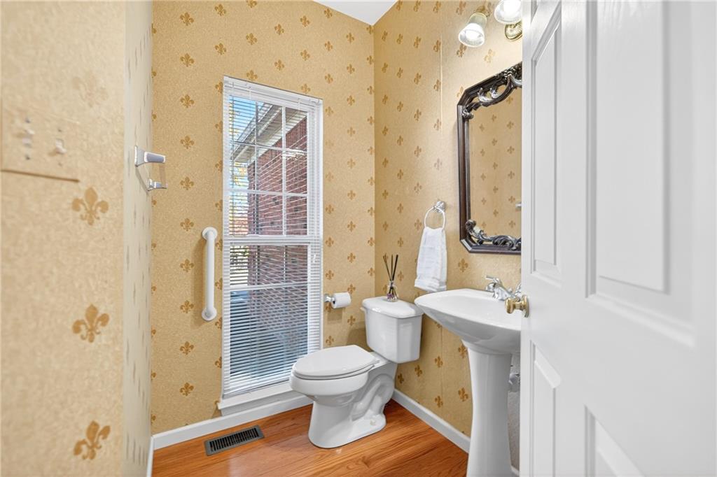 809 Wible Run Road Pittsburgh, PA 15209 - Photo 15 of 36 a white toilet sitting next to a bathroom sink