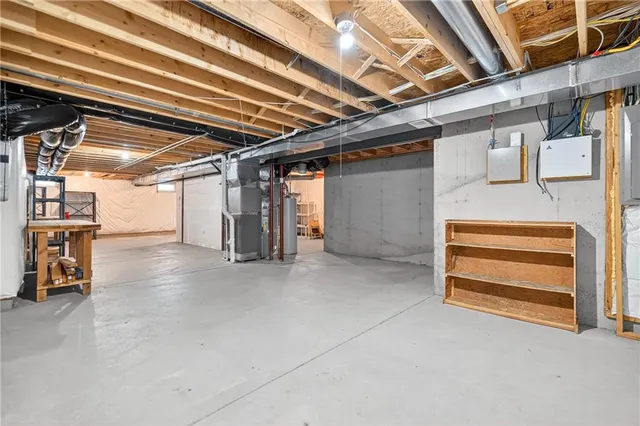 a view of empty room with wooden ceiling