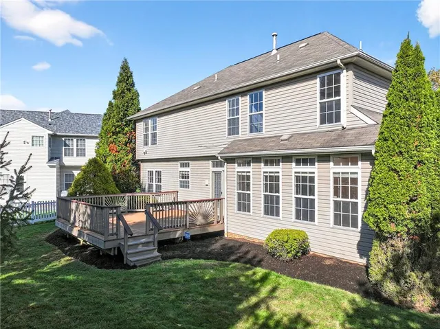 a view of a house with backyard and porch