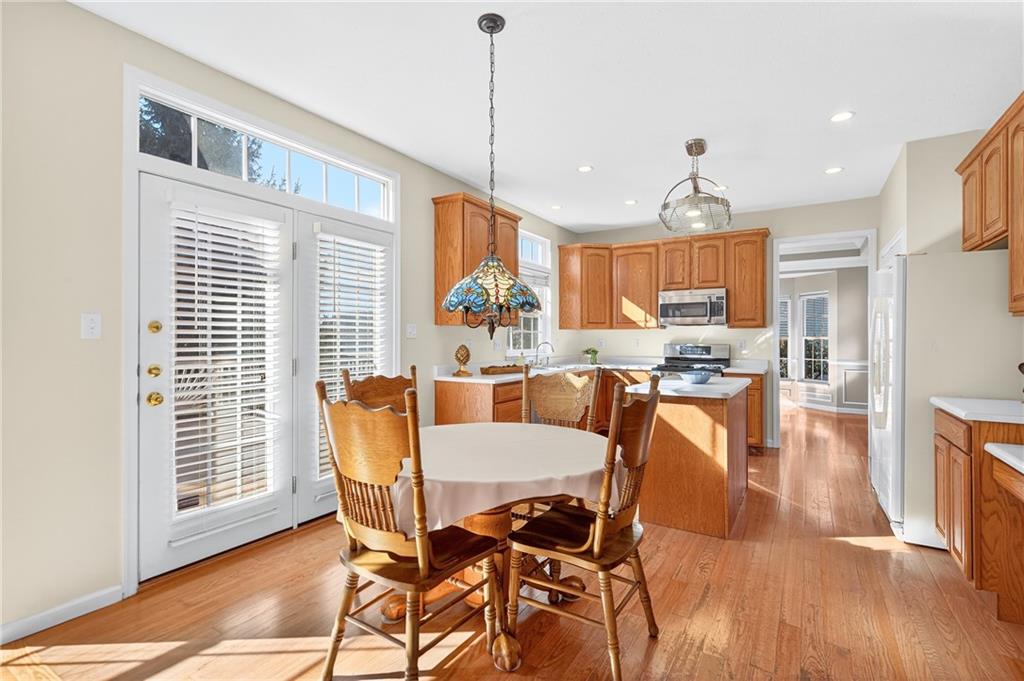 809 Wible Run Road Pittsburgh, PA 15209 - Photo 10 of 36 a view of a dining room with furniture window and wooden floor