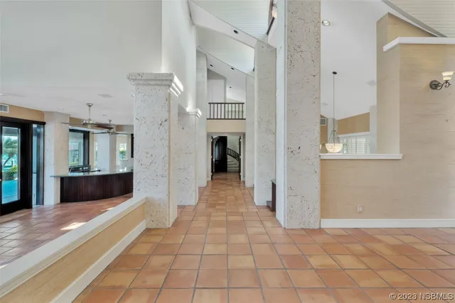 a living room with furniture a window and flowerpot
