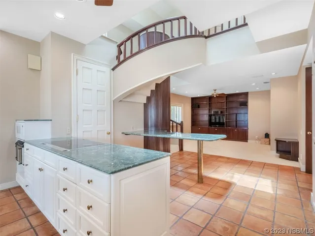 a bathroom with a tub a sink and a large mirror