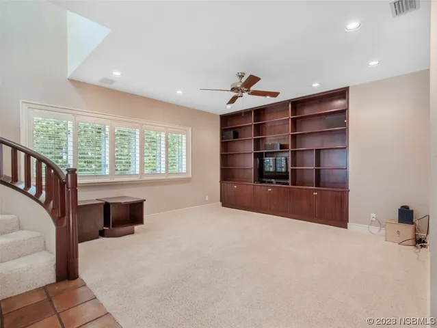 a view of an empty room with stairs
