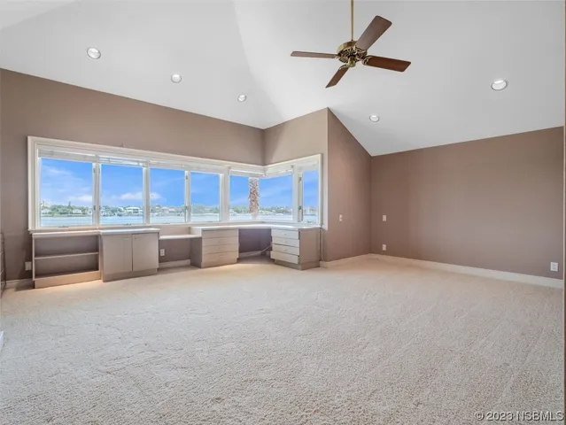 a bathroom with a double vanity sink toilet mirror and bathtub