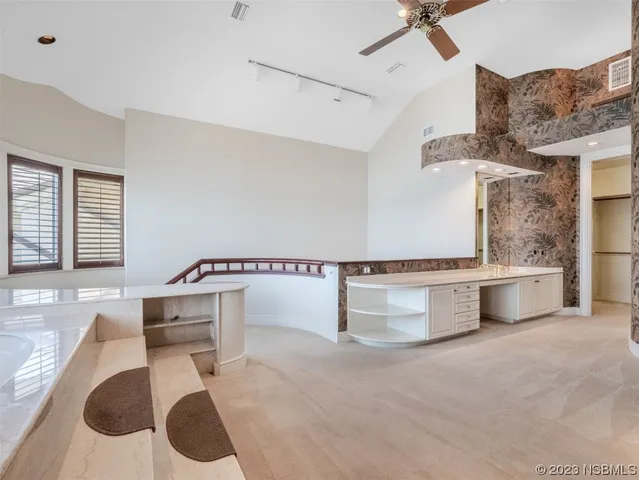 a bathroom with a bathtub a mirror a sinks and a shower