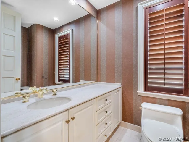 a view of a lake with boats and trees in the background