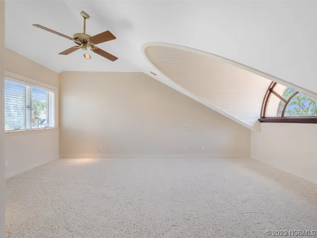a view of a house with backyard porch and sitting area