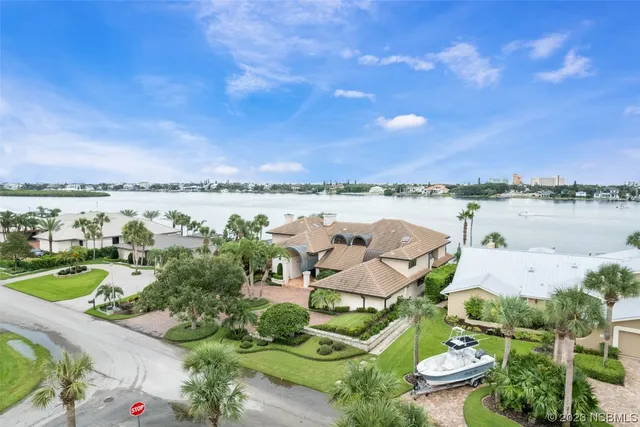 a view of a hallway with wooden shelves