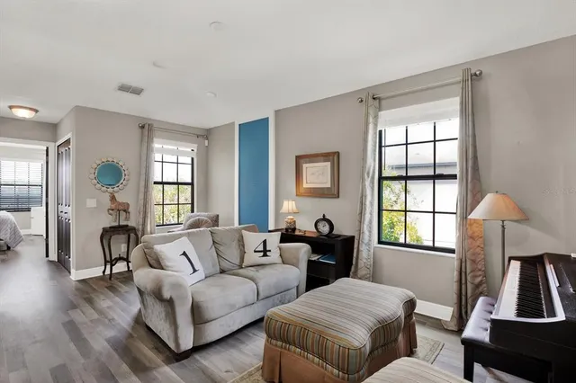 a living room with furniture and a window