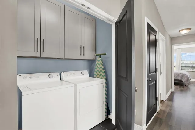 a view of storage and utility room with washer and dryer