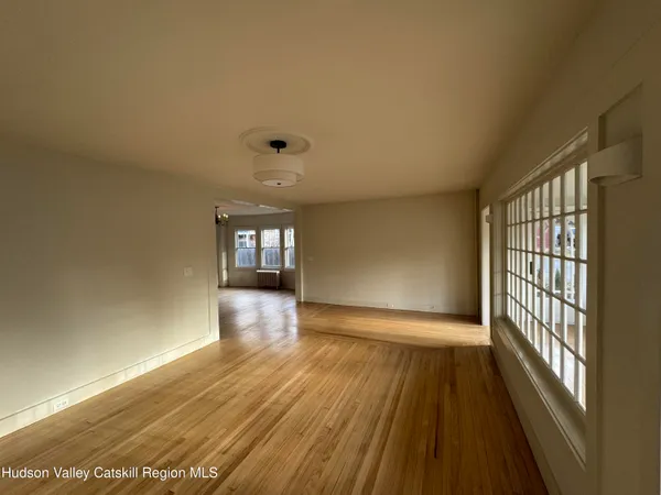 wooden floor in a hall with an entryway