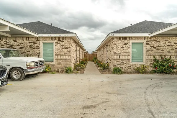a view of a car parked in front of a house